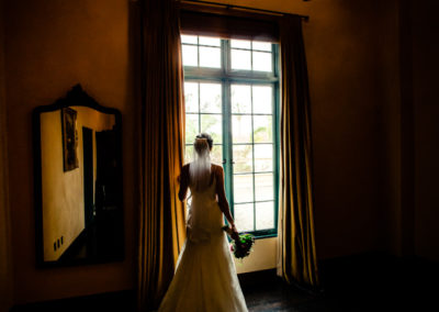 bride looking out window brant bender photography
