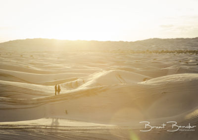 couple standing algodones dunes brant bender photography