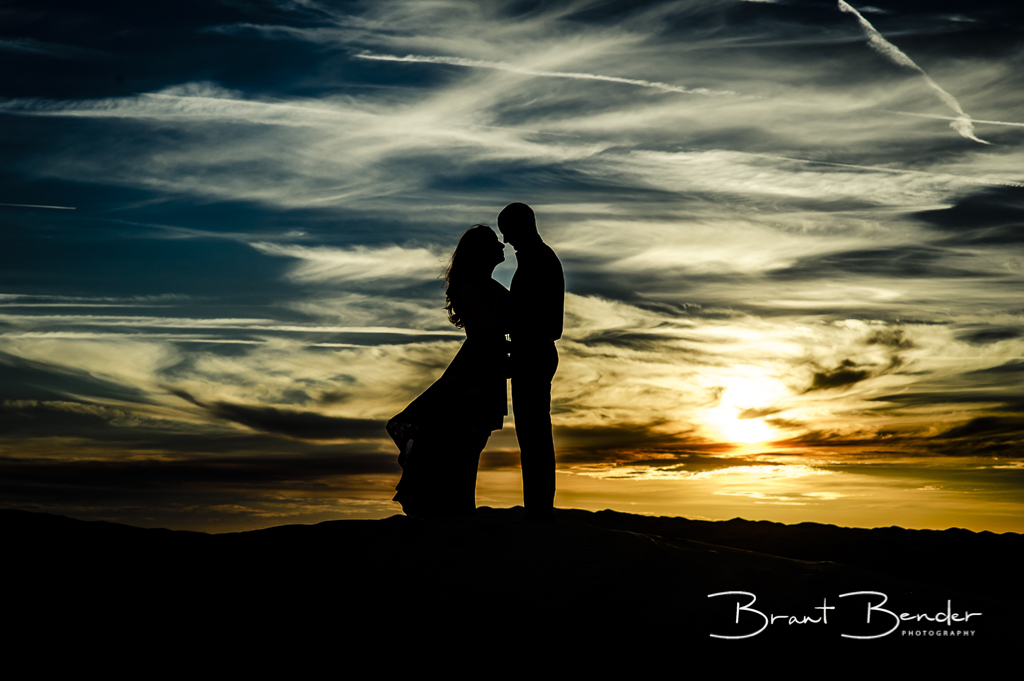 silhouette of couple algodones dunes brant bender photography