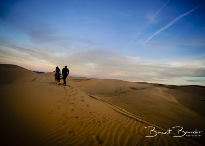 couple walking algodones dunes brant bender photography