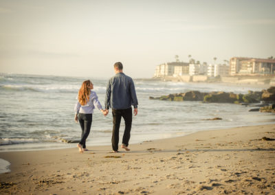 couple walking on california beach