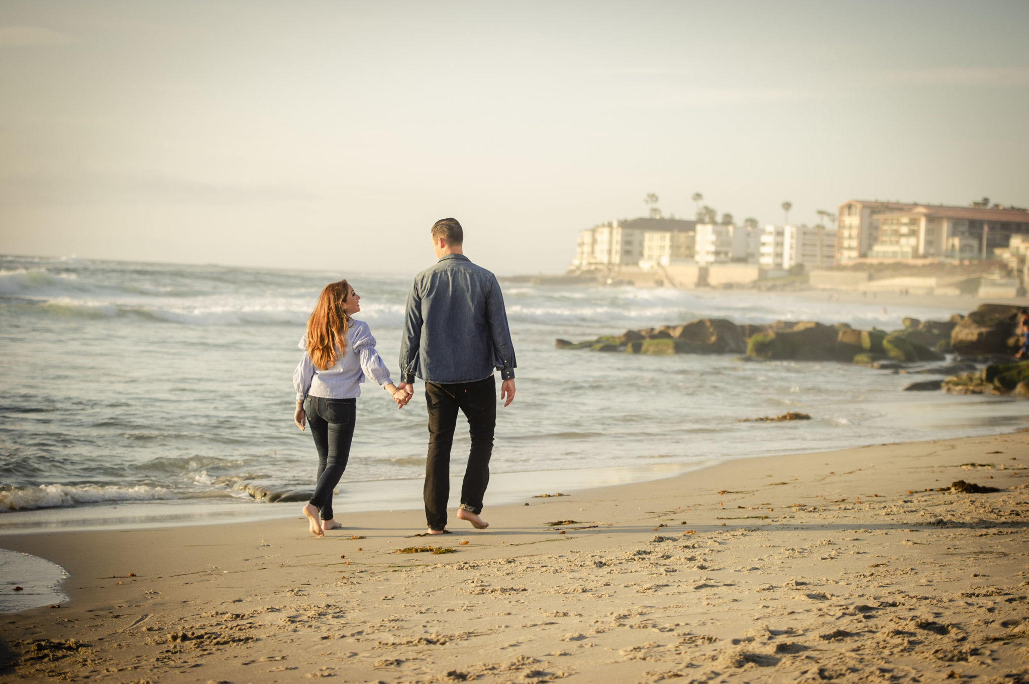 couple walking on california beach