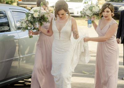 bridesmaids holding wedding dress san diego