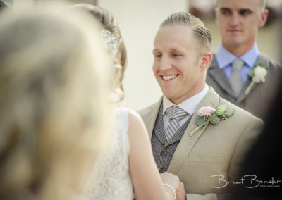happy groom looking at bride brant bender photography