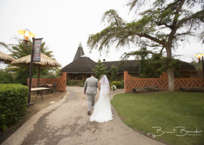 bride and groom walking away
