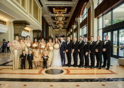 entire wedding party lined up gold and navy