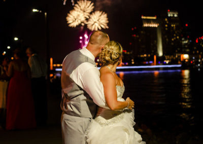 bride and groom looking at fireworks