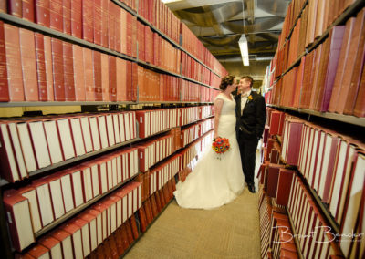 couple kissing in library brant bender photography