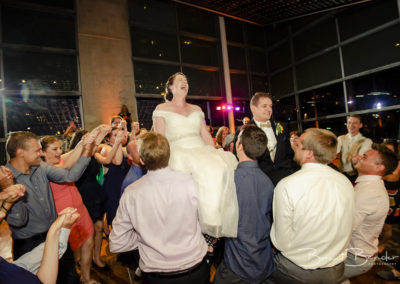 bride being lifted by chair