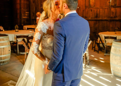 bride and groom kiss rustic wedding
