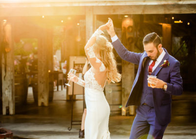 candid bride and groom dancing
