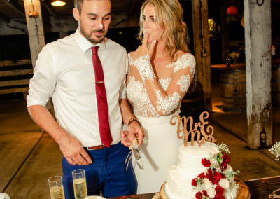 bride and groom cake cutting candid bernardo winery