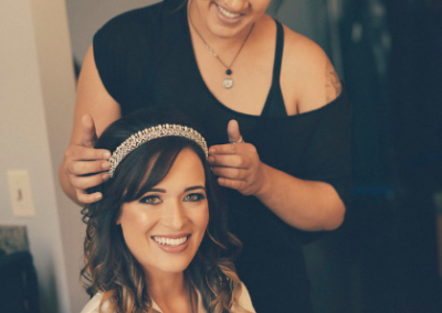 professional makeup artist with bride getting ready