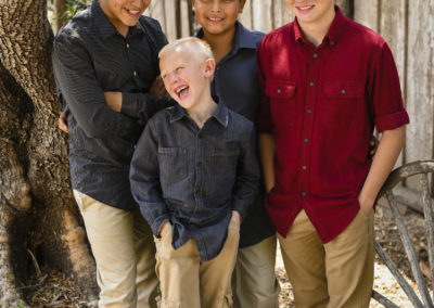 four sons smiling young happy