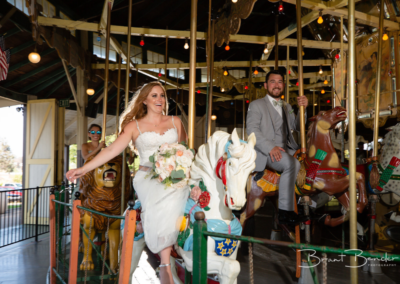 bride and groom on carousel