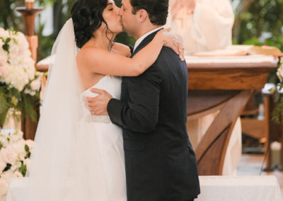 bride and groom catholic wedding kissing