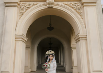 dramatic bride and groom portrait in front of corridor