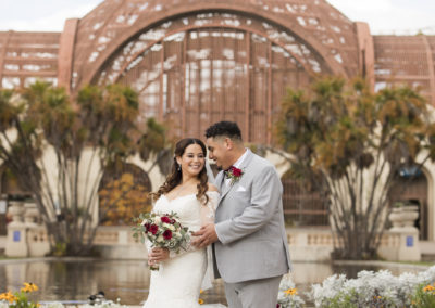 bride and groom in front of balboa park san diego brant bender photography