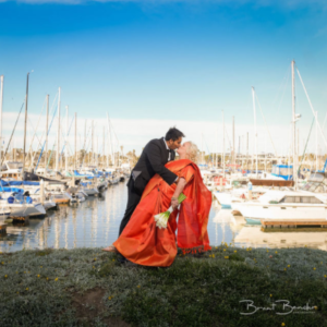 bride and groom kissing harbor view loft boats